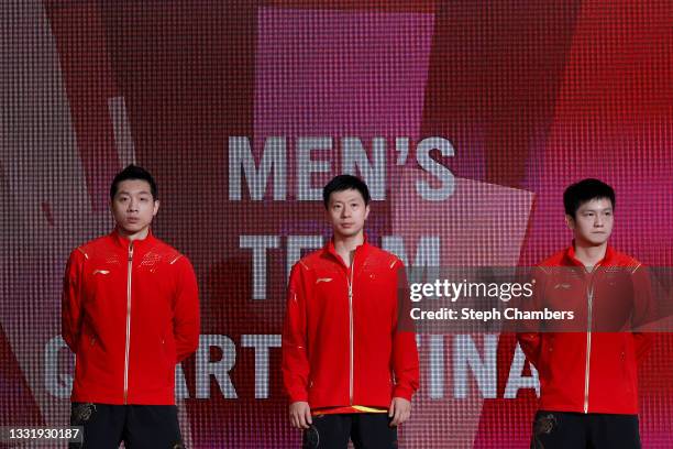 Xu Xin, Ma Long and Fan Zhengdong of Team China arrive for the Men's Team Quarterfinals table tennis match on day ten of the Tokyo 2020 Olympic Games...