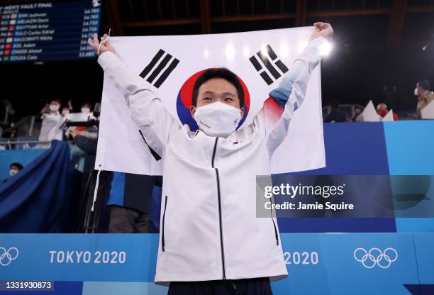 Jeahwan Shin of Team South Korea celebrates a South Korean flag during the Men's Vault Final on day ten of the Tokyo 2020 Olympic Games at Ariake...