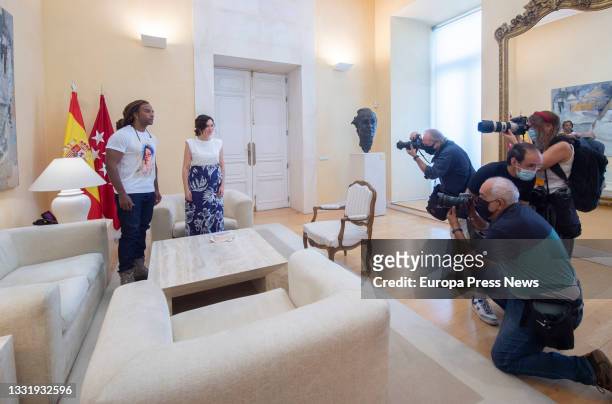 The president of the Community of Madrid, Isabel Diaz Ayuso, during a meeting with Cuban artist Yotuel Romero at the Real Casa de Correos, on August...