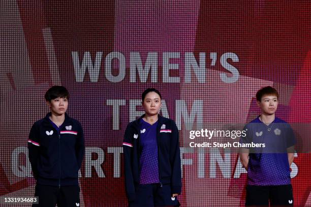 Cheng I Ching, Cheng Hsien-tzu and Chen Szu-yu of Team Chinese Taipei arrive for their Women's Team Quarterfinals table tennis match on day ten of...