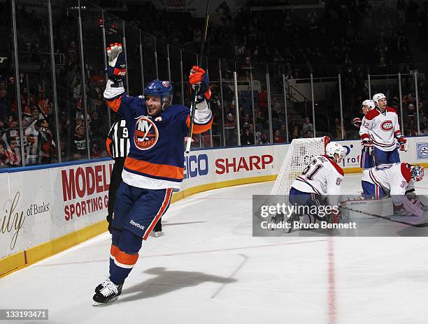 Mark Streit of the New York Islanders scores at 9:08 of the second period against the Montreal Canadiens at the Nassau Veterans Memorial Coliseum on...