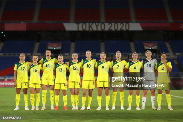 Players of Team Australia stand for the national anthem prior to the Women's Semi-Final match between Australia and Sweden on day ten of the Tokyo...