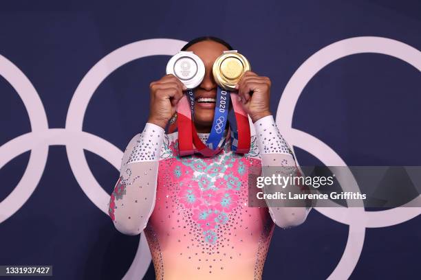 Rebeca Andrade of Team Brazil poses with her women's all-around silver and vault gold medals during the Women's Floor Exercise Final on day ten of...