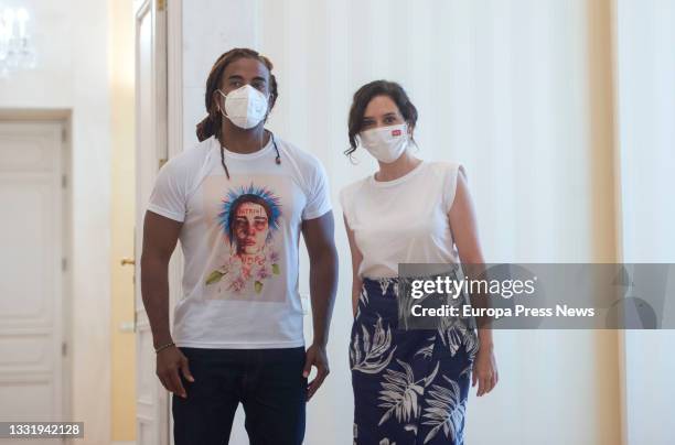 The president of the Community of Madrid, Isabel Diaz Ayuso, and Cuban artist Yotuel Romero at the Real Casa de Correos after a meeting, August 2 in...