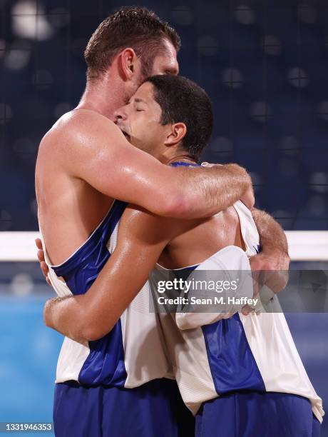 Alison Cerutti and Alvaro Morais Filho of Team Brazil react as they compete against Team Mexico during the Men's Round of 16 beach volleyball on day...