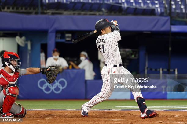 Seiya Suzuki of Team Japan hits a solo home run in the fifth inning against Team United States during the knockout stage of men's baseball on day ten...
