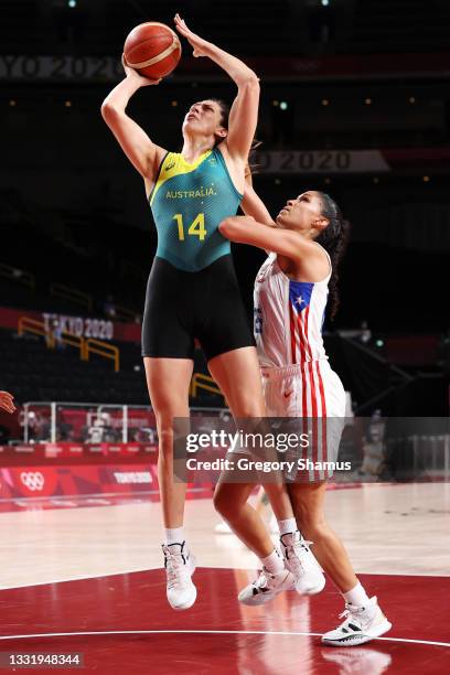 Marianna Tolo of Team Australia drives to the basket against Isalys Quinones of Team Puerto Rico during the first half of a Women's Basketball...