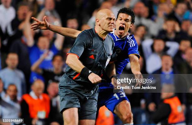 Michael Ballack of Chelsea complains to the referee Tom Henning Ovrebo after he turned down a penalty claim in the final minute of the Chelsea v...