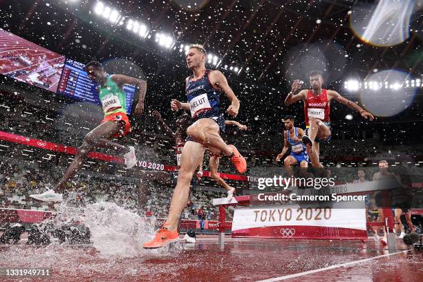 Lamecha Girma of Team Ethiopia, Alexis Phelut of Team France and Mohamed Tindouft of Team Morocco compete in the Men's 3000 metres Steeplechase Final...