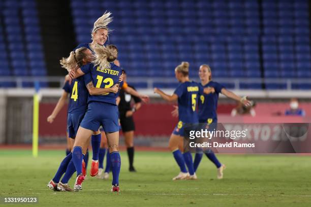 Players of Team Australia celebrate their side's victory after the Women's Semi-Final match between Australia and Sweden on day ten of the Tokyo 2020...