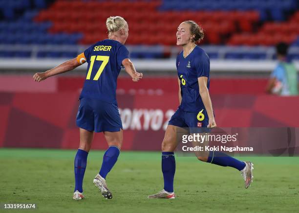 Magdalena Eriksson of Team Sweden celebrates their side's victory with Caroline Seger of Team Sweden after the Women's Semi-Final match between...