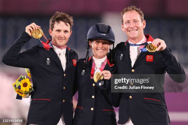 Gold medalists Tom McEwen, Laura Collett and Oliver Townend of Team Great Britain pose with their gold medals during the Eventing Jumping Team medal...