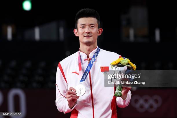 Silver medalist Chen Long of Team China poses on the podium during the medal ceremony for the Men’s Singles badminton event on day ten of the Tokyo...