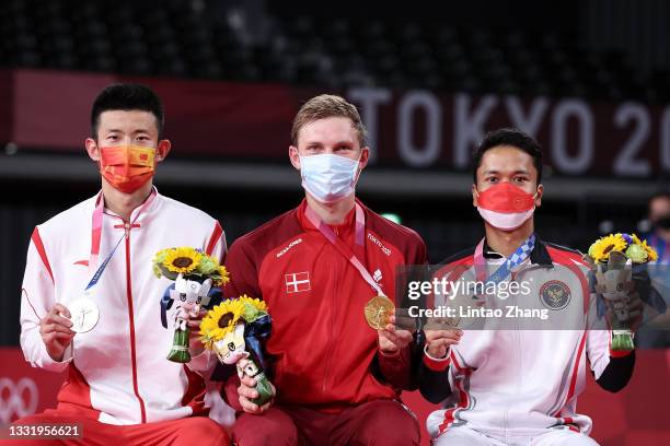 Silver medalist Chen Long of Team China, gold medalist Viktor Axelsen of Team Denmark and bronze medalist Anthony Sinisuka Ginting of Team Indonesia...