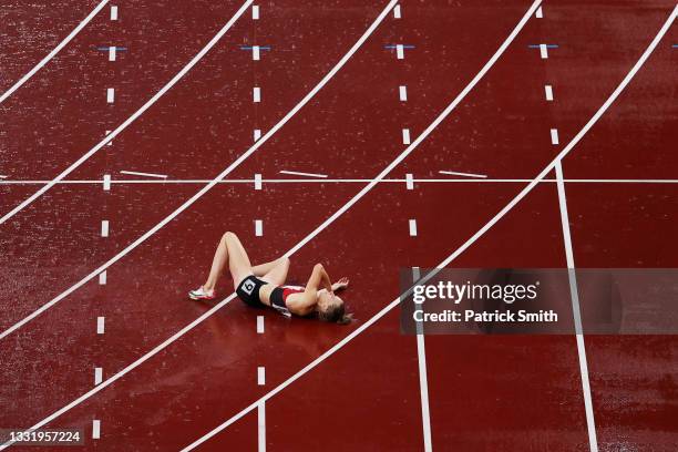 Sara Slott Petersen of Team Denmark lays injured during the Women's 400 metres hurdles semi finals on day ten of the Tokyo 2020 Olympic Games at...