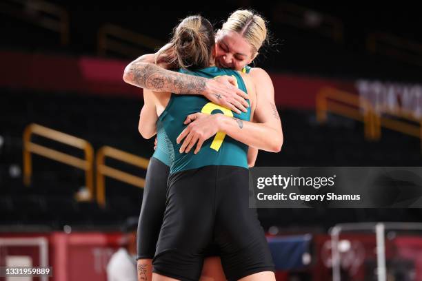 Bec Allen of Team Australia and teammate Cayla George celebrate after defeating Puerto Rico in a Women's Basketball Preliminary Round Group C game on...