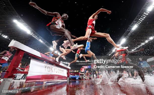 Soufiane El Bakkali of Team Morocco and Benjamin Kigen of Team Kenya compete in the mens 3000 metre Steeplechase final on day ten of the Tokyo 2020...