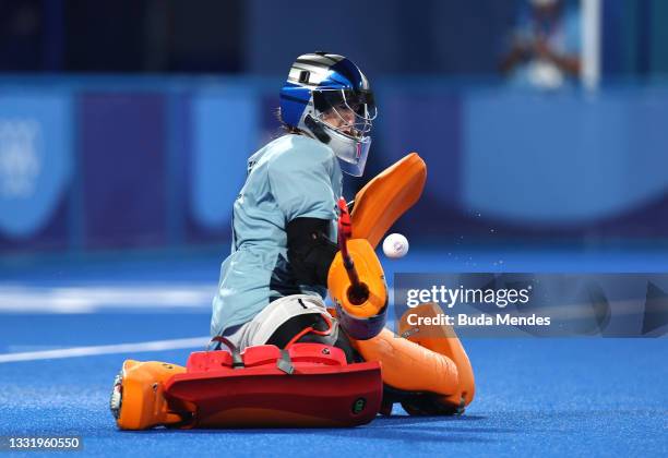 Madeleine Claire Hinch of Team Great Britain makes a save from Clara Ycart Canal of Team Spain in Spain's first penalty of the penalty shootout...