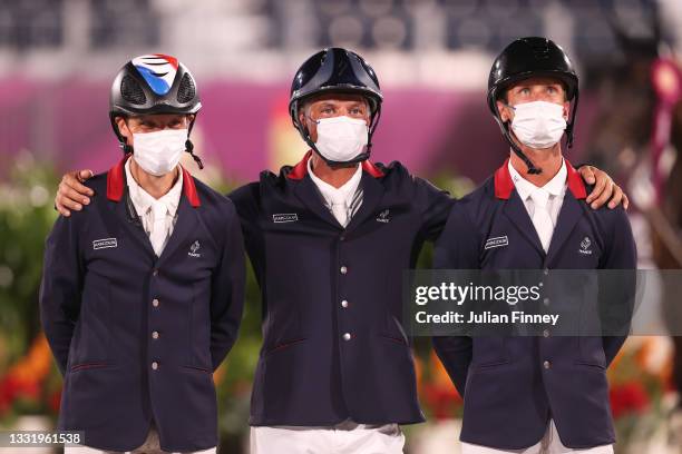 Bronze medalists Nicolas Touzaint, Karim Florent and Christopher Six of Team France pose with their bronze medals during the Eventing Jumping Team...