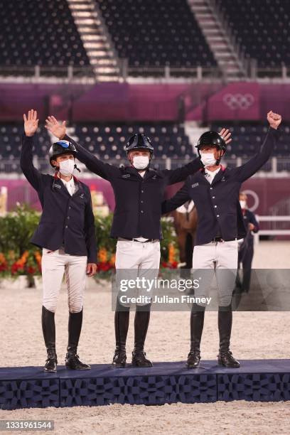 Bronze medalists Nicolas Touzaint, Karim Florent and Christopher Six of Team France pose with their bronze medals during the Eventing Jumping Team...