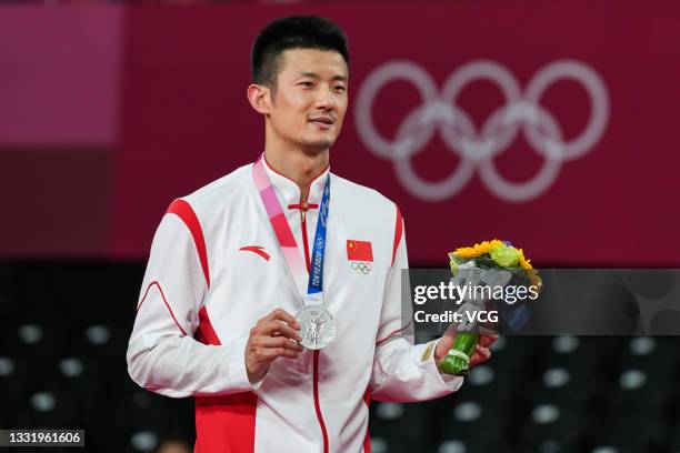 Silver medalist Chen Long of China poses during the medal ceremony for the Badminton Men's Singles Gold Medal Match on day ten of the Tokyo 2020...