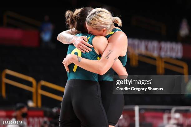 Bec Allen of Team Australia and teammate Cayla George celebrate after defeating Puerto Rico in a Women's Basketball Preliminary Round Group C game on...