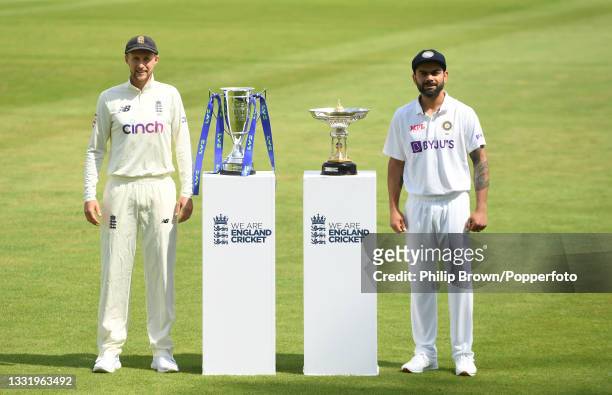 Joe Root of England and Virat Kohli of India pose with the series trophies before Wednesday's first Test match against India at Trent Bridge on...