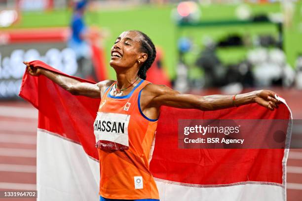 Sifan Hassan of the Netherlands celebrating her win with the flag of the Netherlands while competing on Women's 5000m Final during the Tokyo 2020...