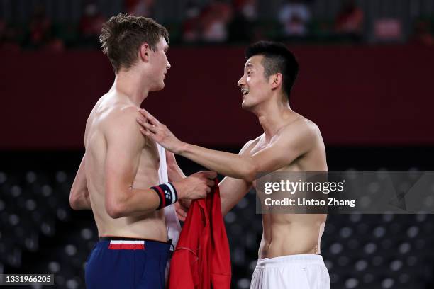 Viktor Axelsen of Team Denmark greets his opponent Chen Long of Team China after winning the Men’s Singles Gold Medal match on day ten of the Tokyo...