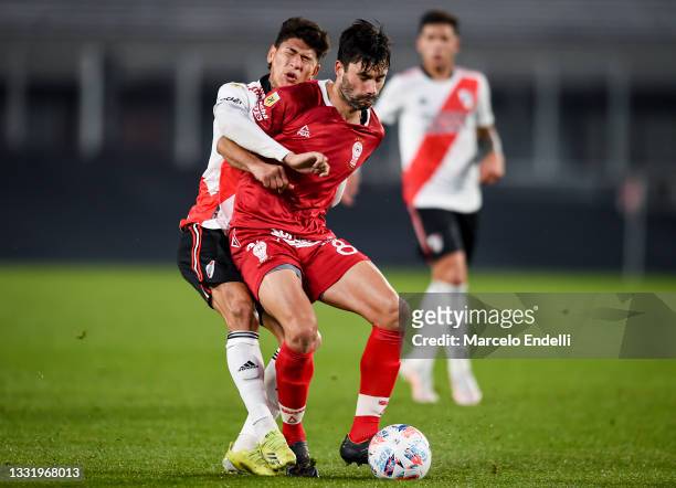 Jorge Carrascal of River Plate fights for the ball with Claudio Yacob of Huracan during a match between River Plate v Huracan as part of Torneo Liga...