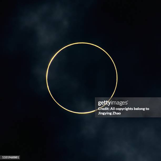 close up of golden annular solar eclipse - solar eclipse stock-fotos und bilder