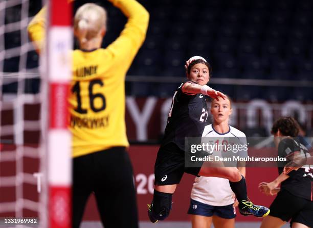 Ayaka Ikehara of Team Japan shoots for goal as Katrine Lunde of Team Norway looks to save as Stine Bredal Oftedal of Team Norway looks on during the...