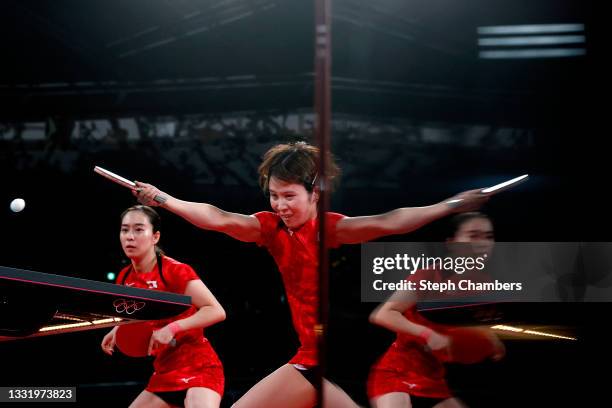 Kasumi Ishikawa and Miu Hirano of Team Japan in action during their Women's Team Quarterfinals table tennis match on day ten of the Tokyo 2020...