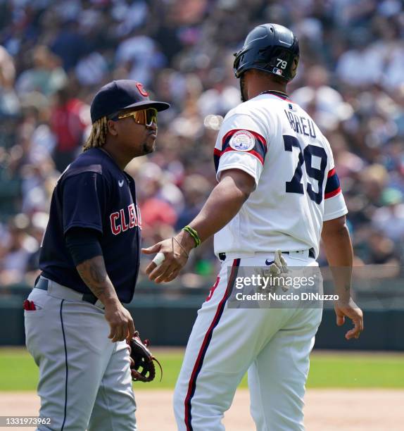 Jose Abreu of the Chicago White Sox talks with Jose Ramirez of the Cleveland Indians at the end of the inning when he was hit by a pitch at...