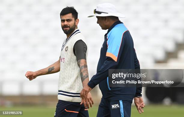 Virat Kohli and Ravi Shastri of India during a training session before Wednesday's first Test match against England at Trent Bridge on August 02,...