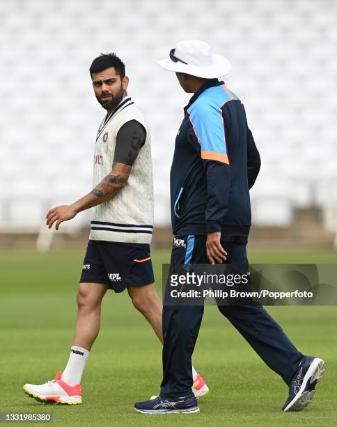 Virat Kohli and Ravi Shastri of India during a training session before Wednesday's first Test match against England at Trent Bridge on August 02,...