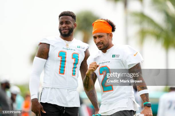 Wide Receiver DeVante Parker and Wide Receiver Albert Wilson of the Miami Dolphins looks on during Training Camp at Baptist Health Training Complex...