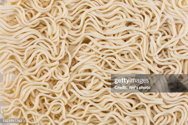 uncooked ramen noodles isolated on white background. - dry pasta stock pictures, royalty-free photos & images