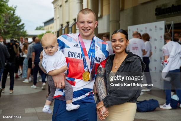 Adam Peaty poses for a photograph his wife Eirianedd Munro and their son George-Anderson Peaty during the National Lottery's event celebrating "our...