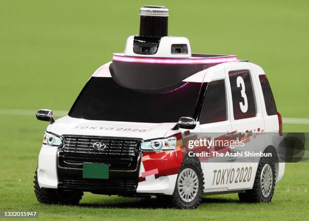Remote control car carrying disc is in operation during the Men's Discus Throw final on day eight of the Tokyo 2020 Olympic Games at Olympic Stadium...