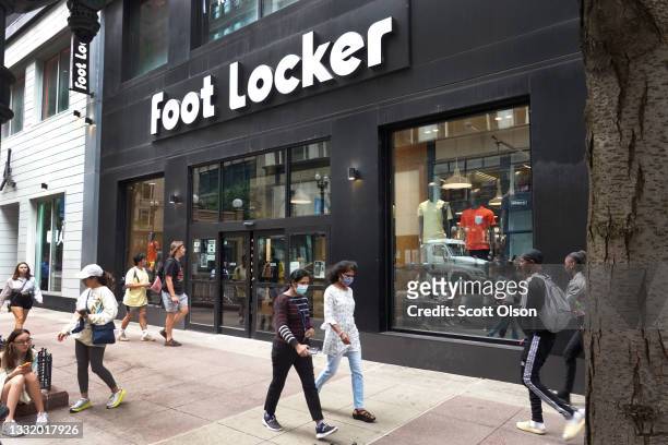 Sign hangs above the entrance of a Foot Locker store on August 02, 2021 in Chicago, Illinois. Foot Locker Inc. Has announced plans to buy athletic...