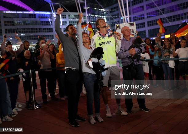 German tennis player and Tokyo 2020 gold medalist Alexander Zverev and his family celebrate surrounded by fans after his arrival at Airport Munich on...