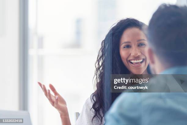 business colleagues having a conversation - business woman looking over shoulder stock pictures, royalty-free photos & images