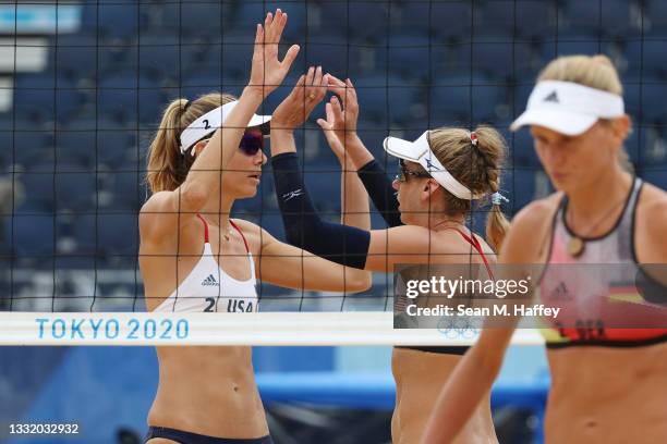 Alix Klineman of Team United States celebrates with April Ross against Team Germany during the Women's Quarterfinal beach volleyball on day eleven of...