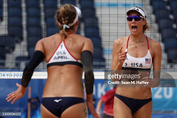 April Ross of Team United States and Alix Klineman celebrate after the play against Team Germany during the Women's Quarterfinal beach volleyball on...
