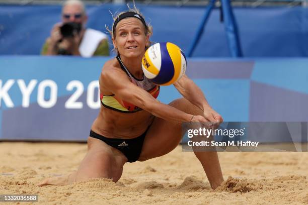 Laura Ludwig of Team Germany returns the ball against Team United States during the Women's Quarterfinal beach volleyball on day eleven of the Tokyo...