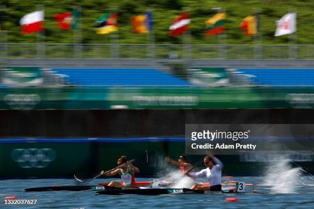 Lisa Carrington of Team New Zealand competes against Teresa Portela of Team Portugal and Qing Ma of Team China during the Women's Kayak Single 200m...