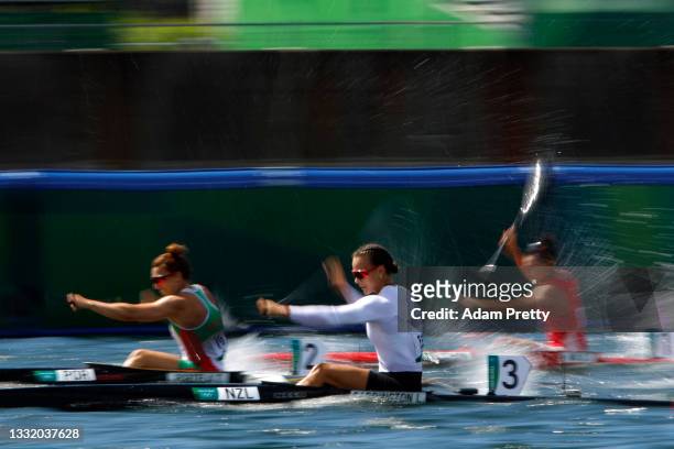 Lisa Carrington of Team New Zealand competes against Teresa Portela of Team Portugal and Qing Ma of Team China during the Women's Kayak Single 200m...