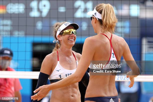 April Ross of Team United States and Alix Klineman celebrate after defeating Team Germany during the Women's Quarterfinal beach volleyball on day...