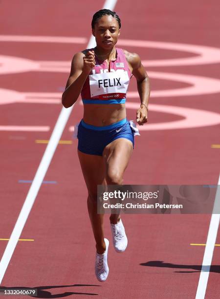 Allyson Felix of Team United States competes in round one of the Women's 400m heats on day eleven of the Tokyo 2020 Olympic Games at Olympic Stadium...